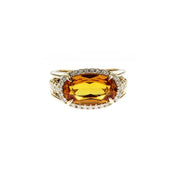 Custom Designed Engagement Ring with Oval Cut Orange Topaz set East-West with Diamond Halo in 14K Yellow Gold