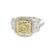 3.38 CT Fancy Yellow Radiant Diamond and 0.70 Cttw Trapezoid Three Stone Halo Platinum Engagement Ring