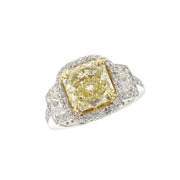 3.38 CT Fancy Yellow Radiant Diamond and 0.70 Cttw Trapezoid Three Stone Halo Platinum Engagement Ring
