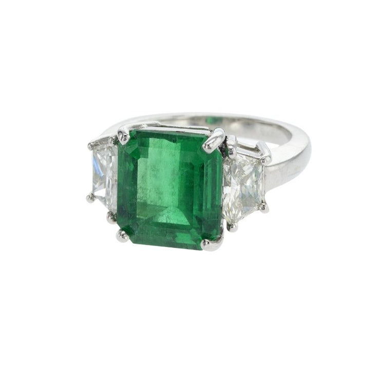 Platinum 5.12 CT Emerald Gemstone and 0.92 CT Trapezoid Diamond Three Stone Ring